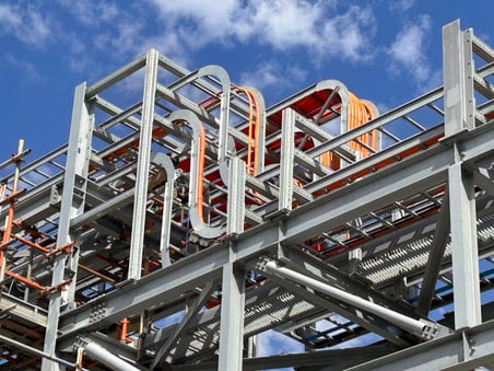 Traditional I steel beams with mechanical cables supported by Sikla siFramo modular supports